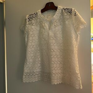 Lovely European lace top. Lined. Short sleeves with  v neck. Zips up back. Sz 44